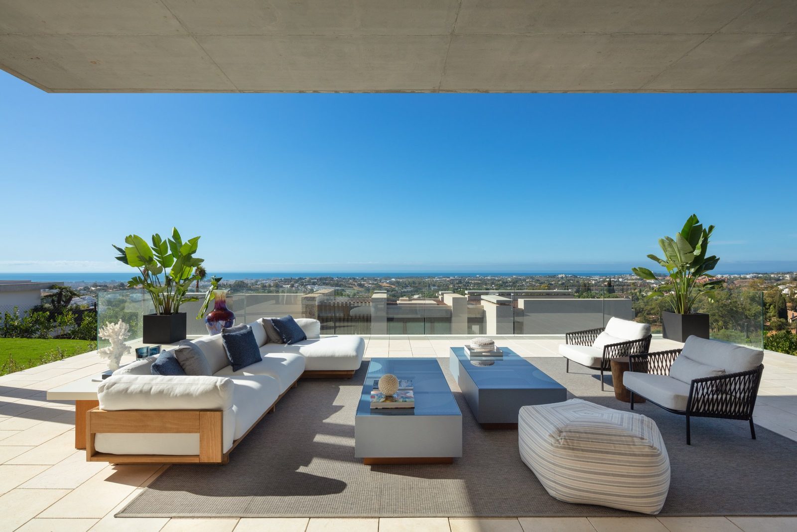 Outdoor terrace lounge with panoramic sea views at a 7-bedroom villa in Málaga - The Estates
