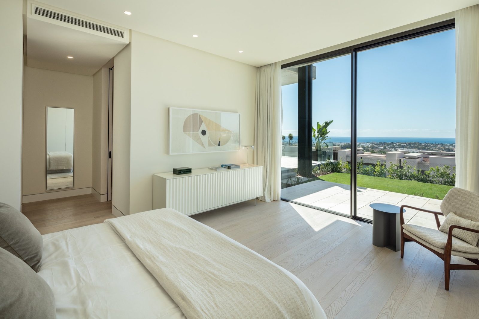 Modern bedroom with panoramic sea views and terrace in a 7-bedroom villa in Málaga - The Estates
