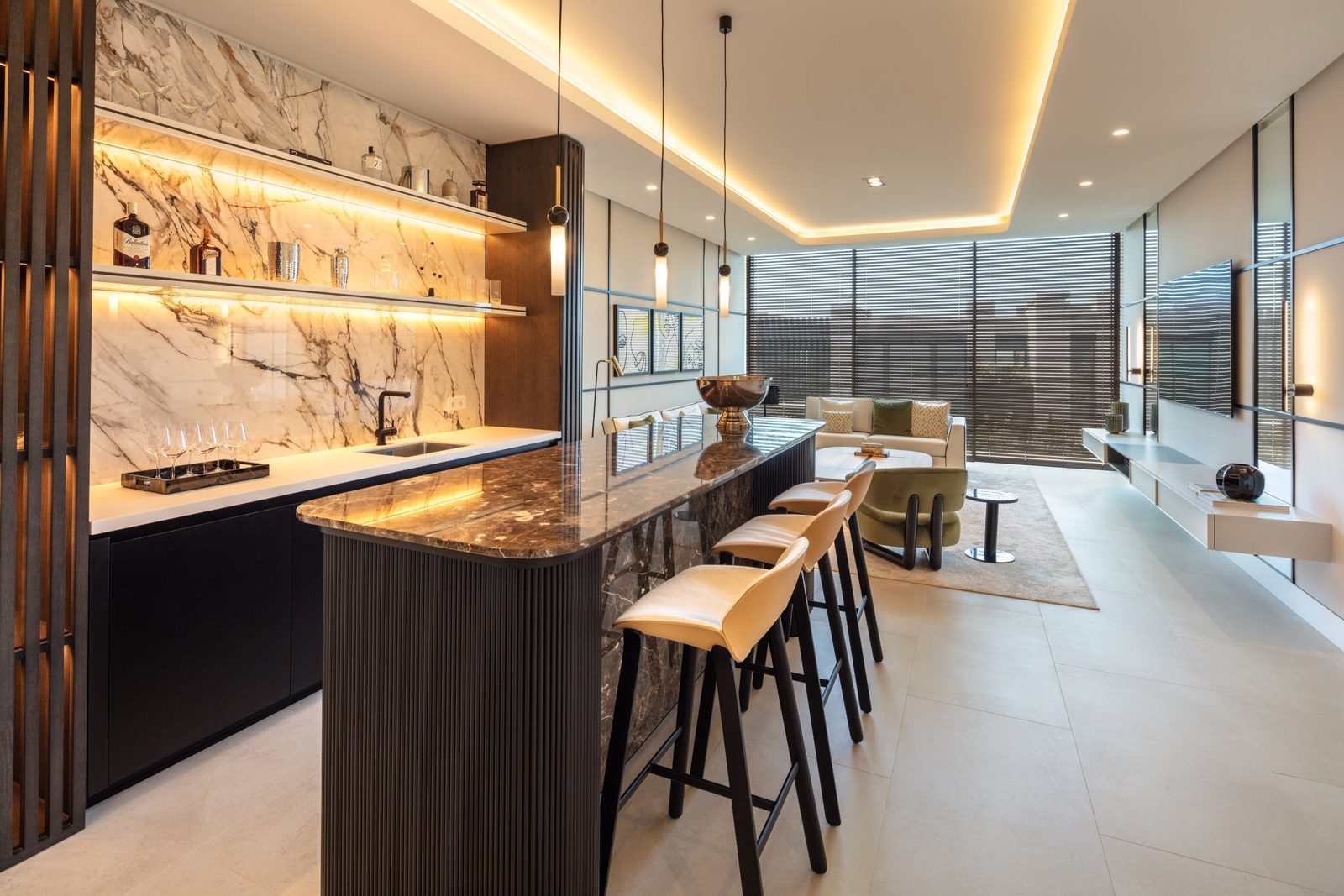 Designer bar and lounge with marble island and pendant lighting of a 7-bedroom villa in Málaga - The Estates
