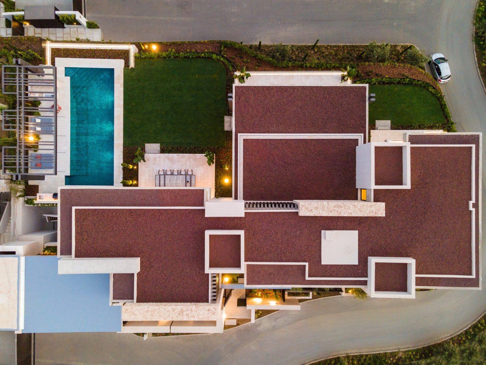 Aerial view of the villa’s pool, landscaped gardens and rooftop terraces in La Quinta, Benahavís, of a 7-bedroom villa in Málaga - The Estates