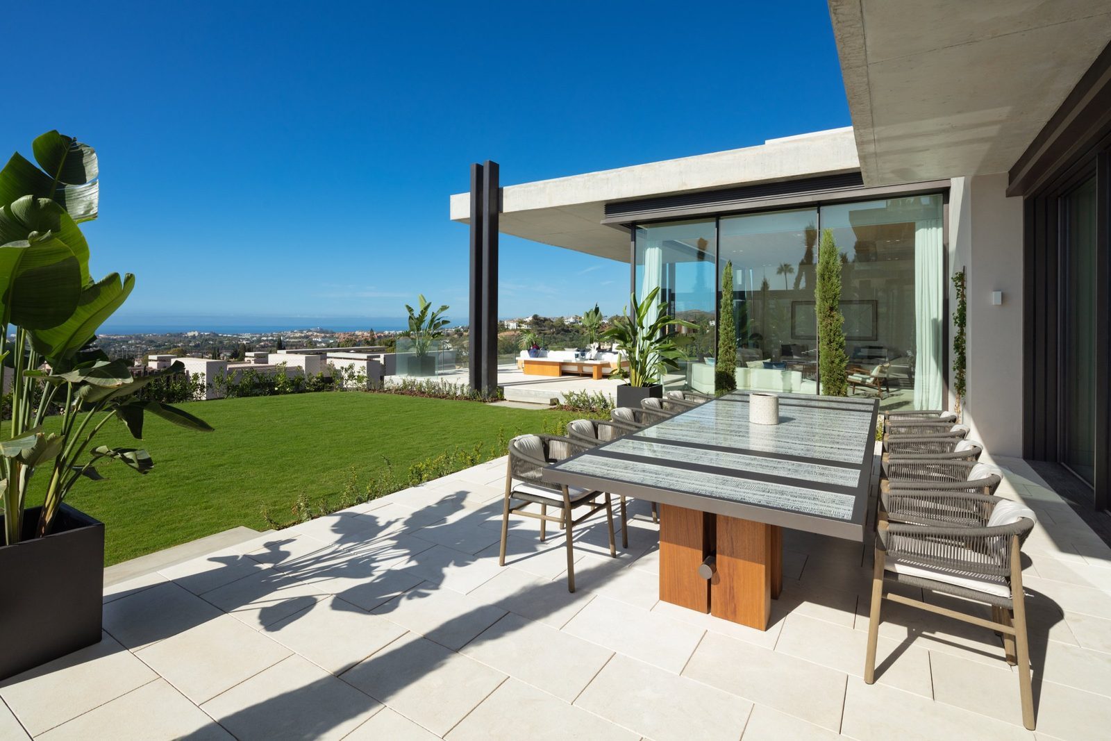 Outdoor dining terrace with panoramic sea views at a 7-bedroom villa in Málaga - The Estates