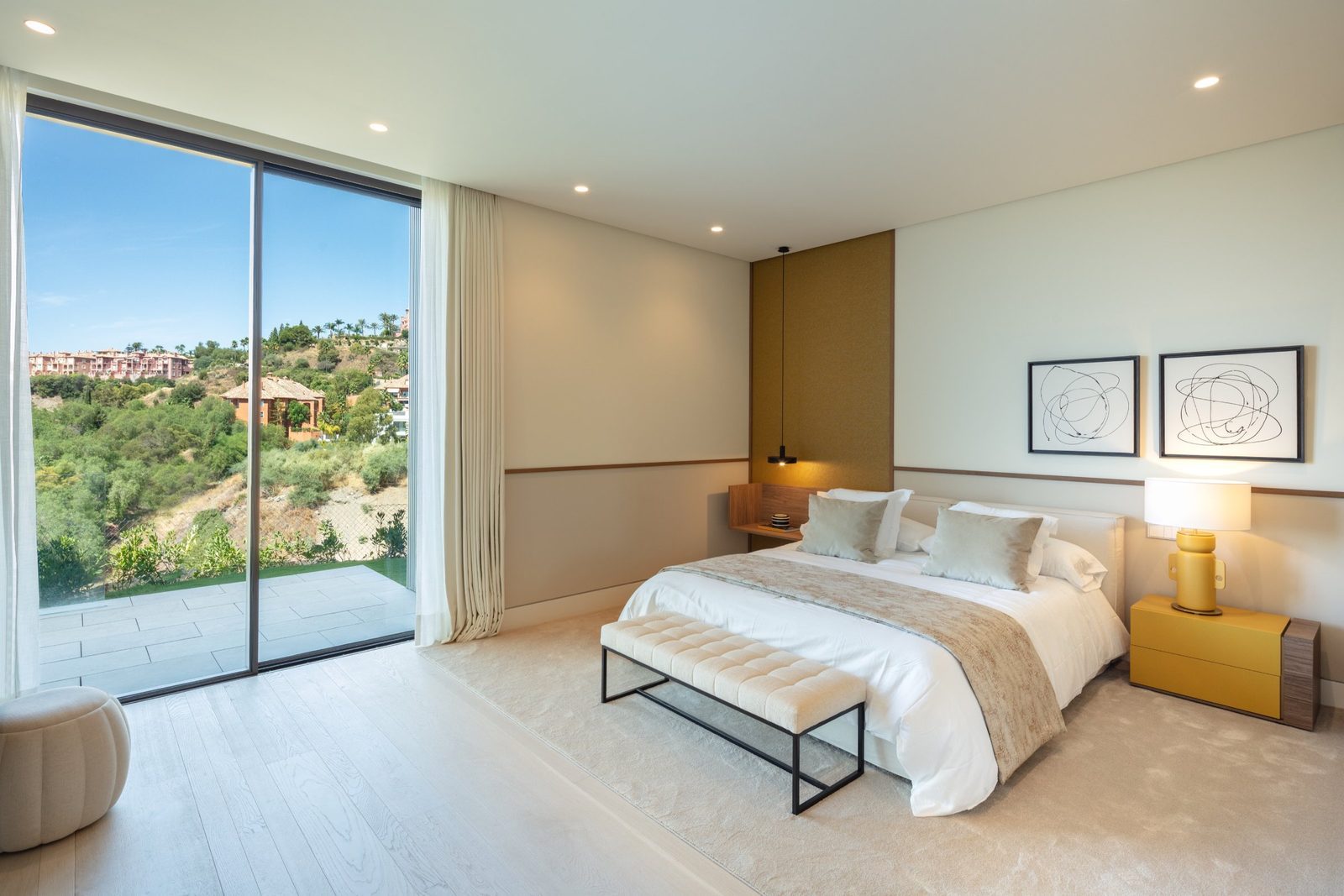Contemporary bedroom with king bed, terrace and hillside views of a 7-bedroom villa in Málaga - The Estates