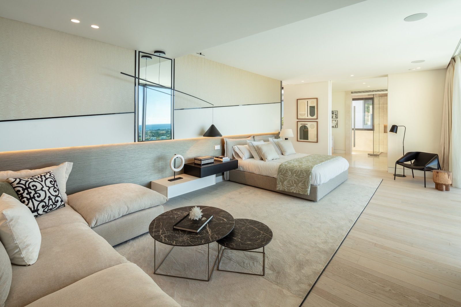 Contemporary bedroom with lounge area