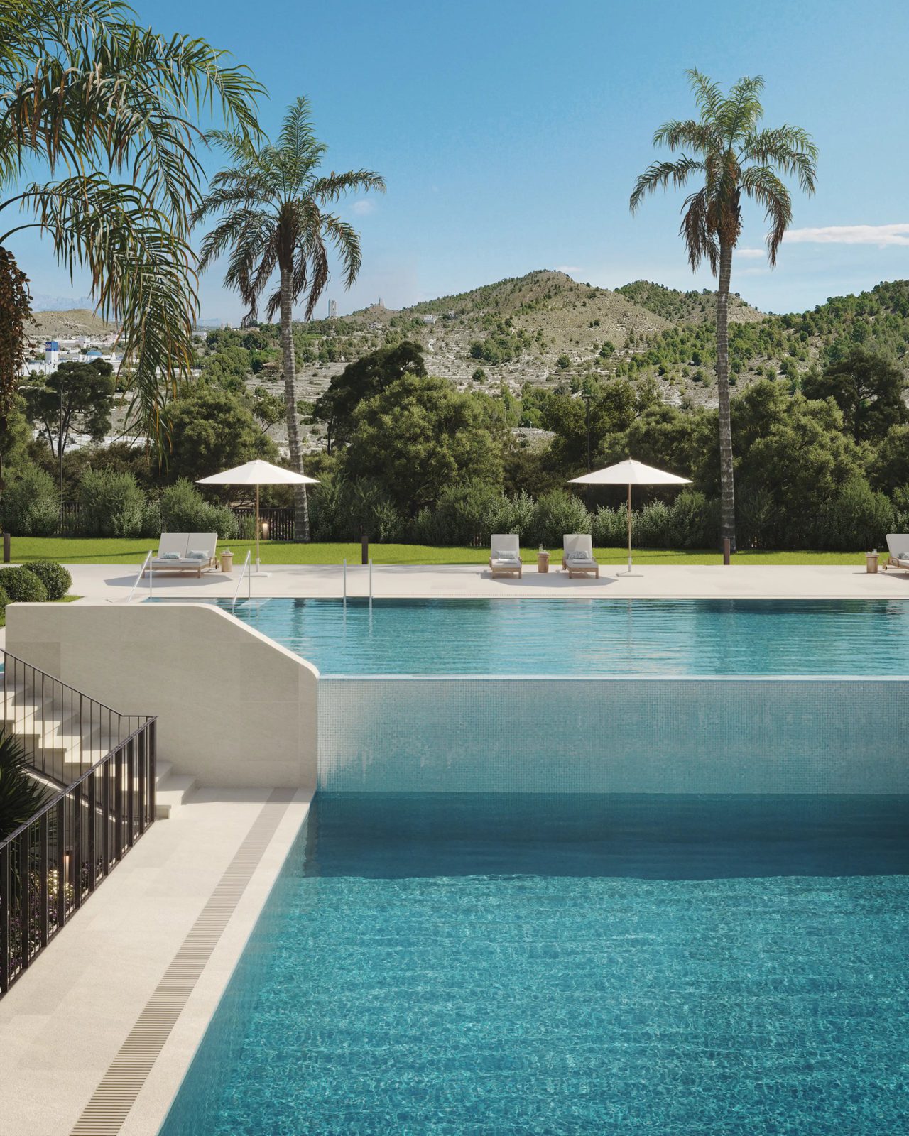 A luxurious pool and garden area with sea views of a 4-bedroom penthouse in Villajoyosa - The Estates