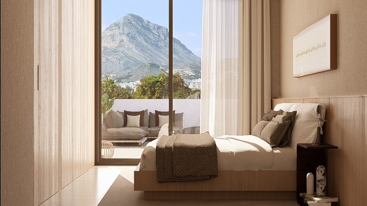 A bright bedroom with mountain views from a 3-bedroom apartment in Jávea - The Estates