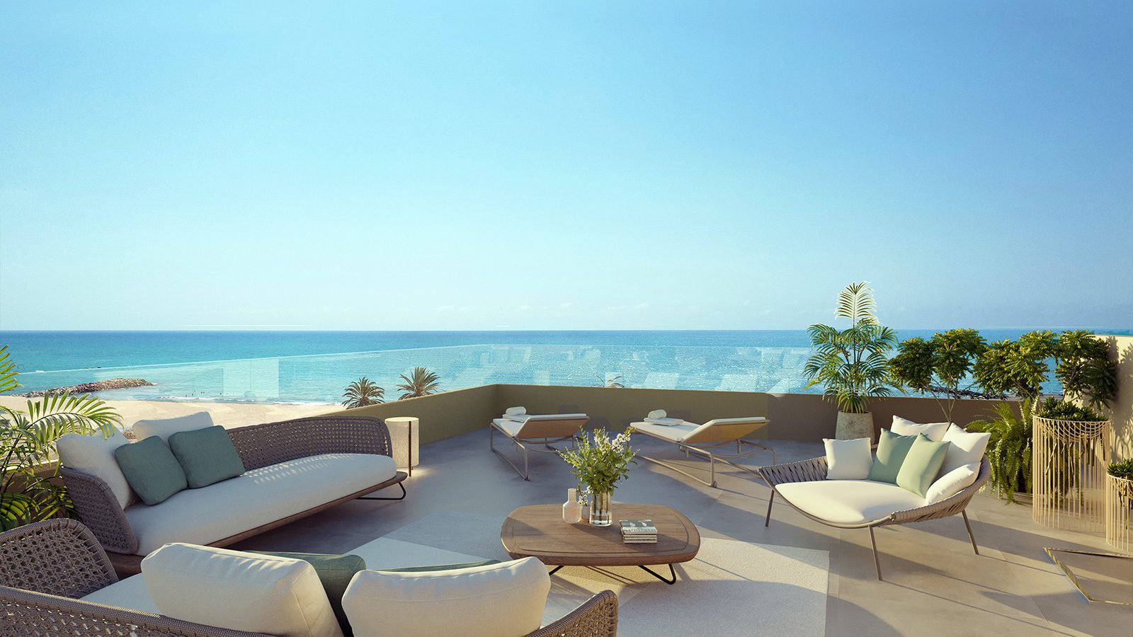 A bright, airy terrace with seating overlooking the beach of a 2-bedroom apartment in El Puig - The Estates