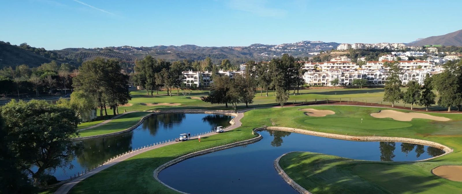 Golf course, lakes and mountain views from a 2-bedroom apartment in Las Lagunas de Mijas - The Estates