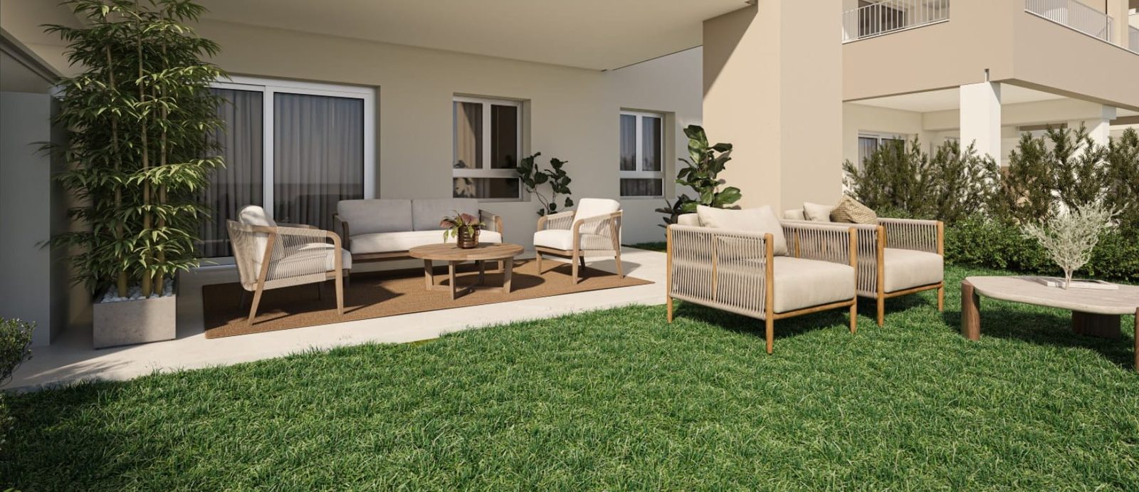 Private garden terrace with outdoor lounge seating at a modern apartment in Las Lagunas de Mijas - The Estates