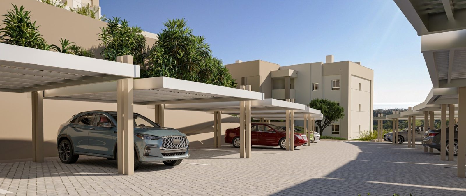 Covered parking bays and landscaped apartment buildings of a 2-bedroom apartment in Las Lagunas de Mijas - The Estates