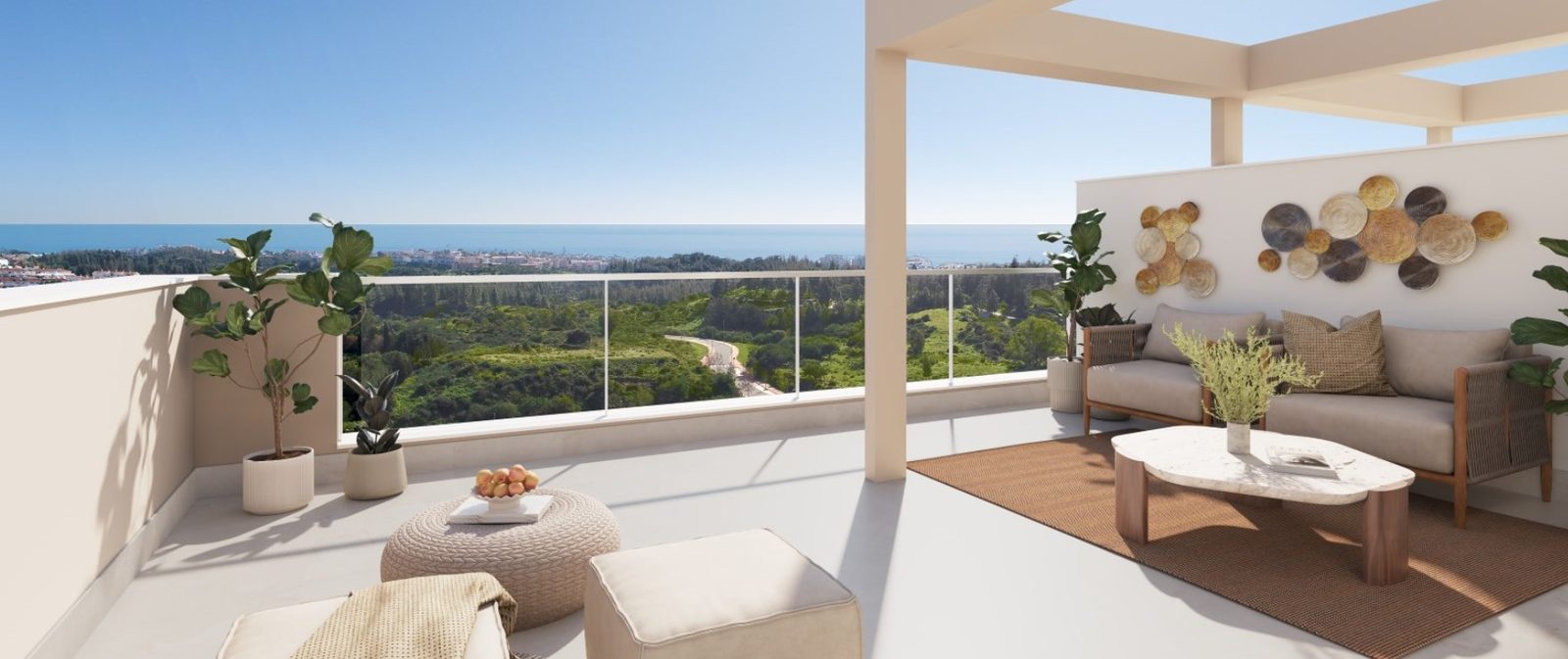 Sea-view terrace with outdoor seating, plants and panoramic coastal views at a 2-bedroom apartment in Las Lagunas de Mijas - The Estates