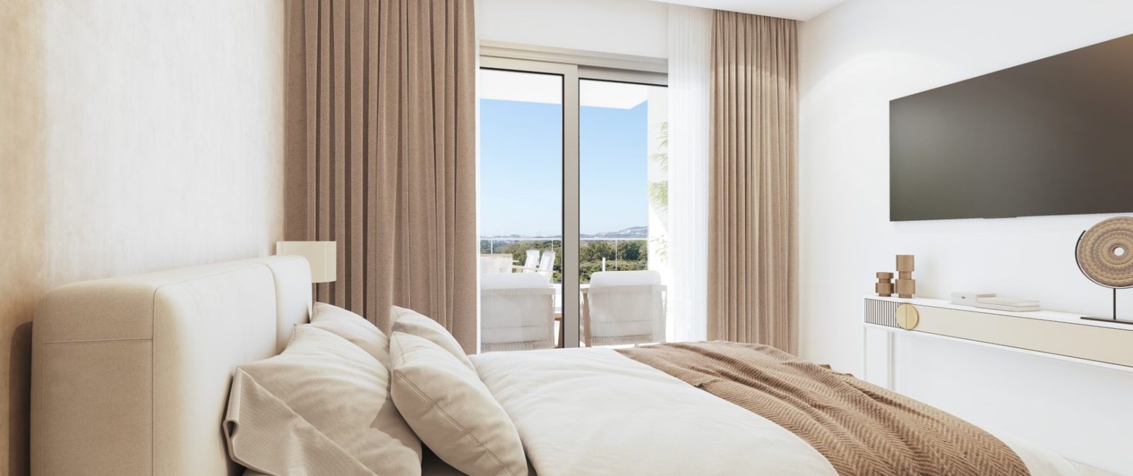 Bright bedroom with king-size bed, wall-mounted TV and terrace views in a 2-bedroom apartment in Las Lagunas de Mijas - The Estates