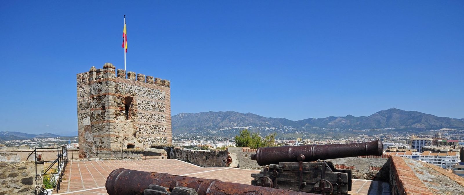 Historic castle tower and cannons overlooking the city and mountains, nearby to a 2-bedroom apartment in Las Lagunas de Mijas - The Estates