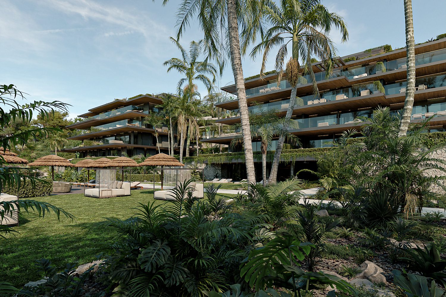 A lush garden and pool area with a modern penthouse building overlooking the sea - The Estates