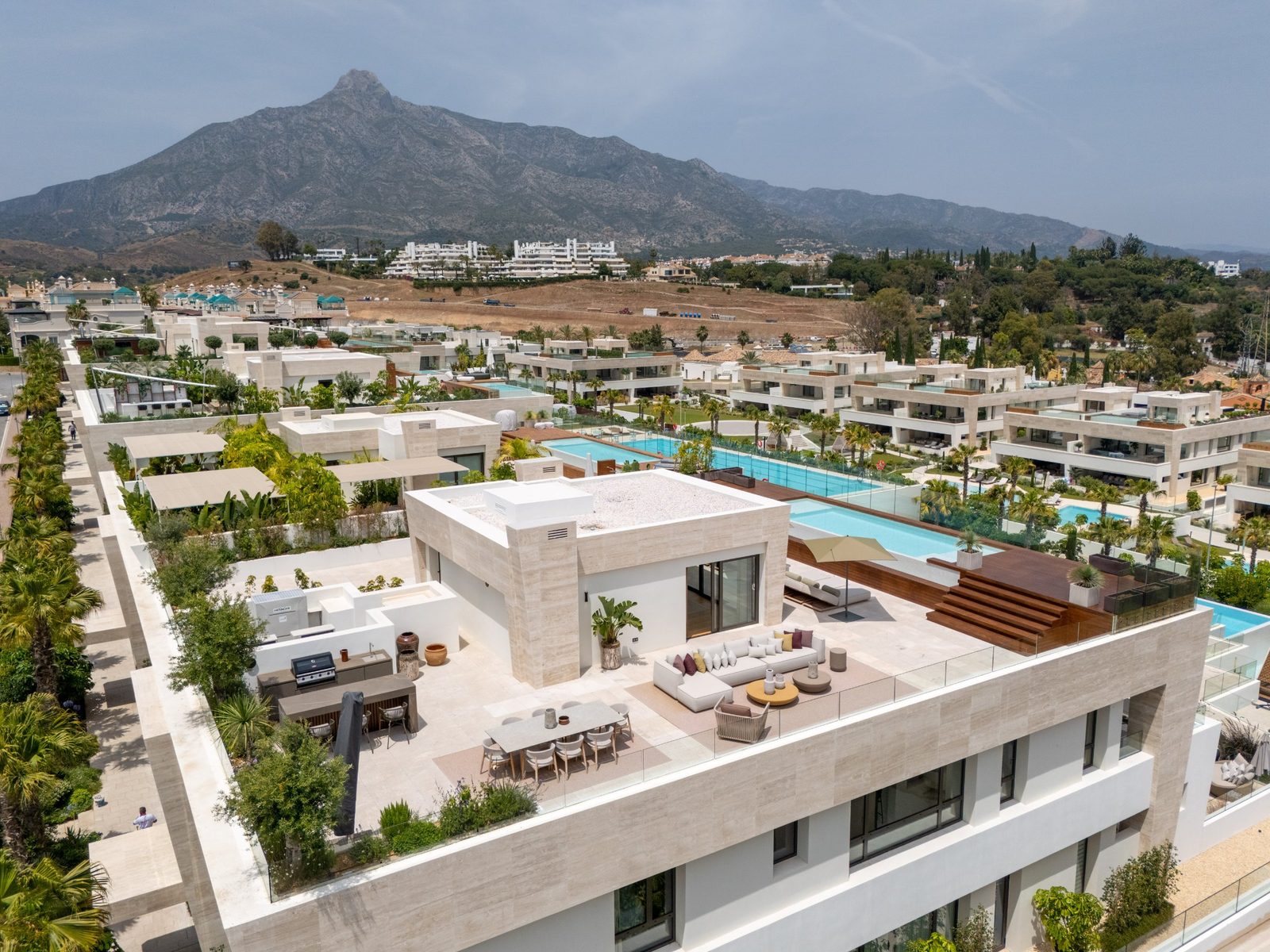 Rooftop terrace with outdoor seating, pool views and La Concha mountain of a 4-bedroom pent