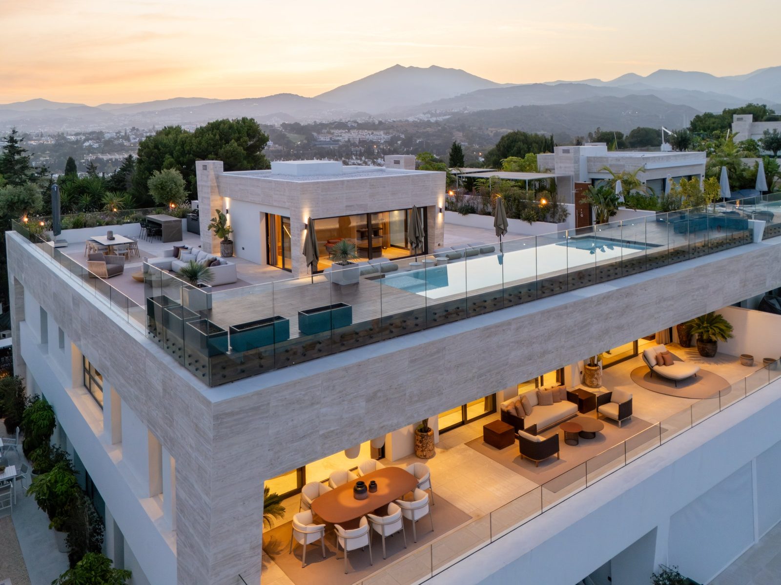 Rooftop terrace with private pool, outdoor seating and mountain views at a 4-bedroom penthouse in Málaga - The Estates