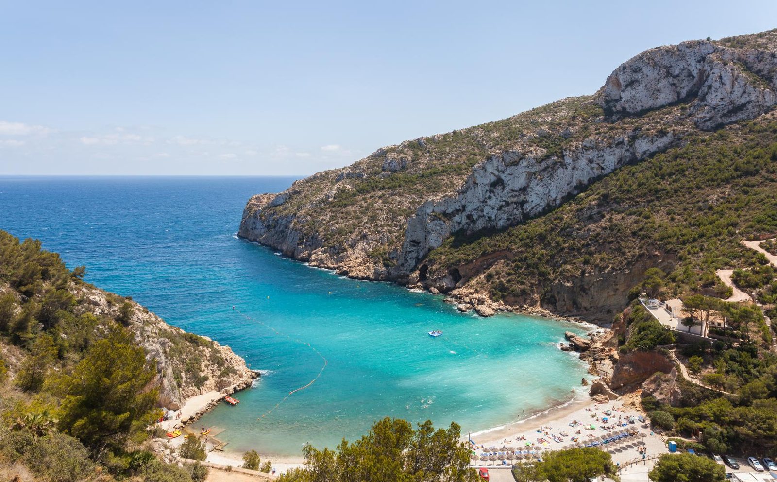 Turquoise sea cove and rugged coastline view from a 4-bedroom villa in Jávea - The Estates