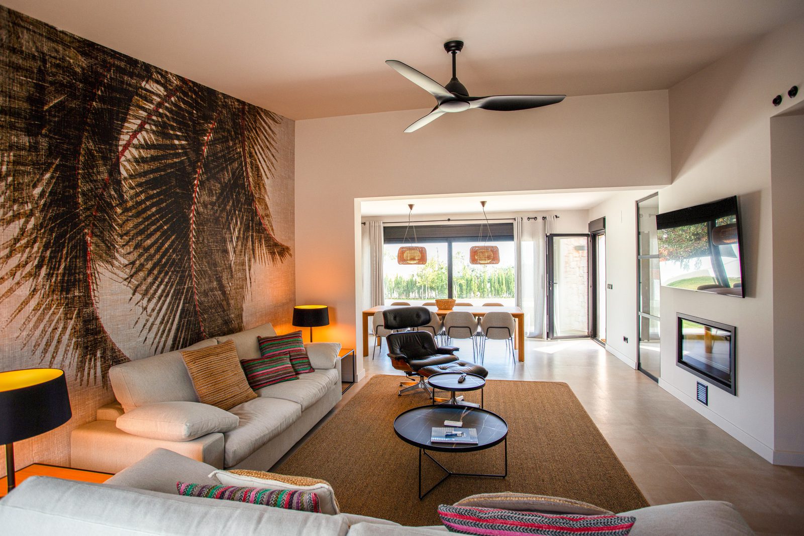 Stylish living room with modern decor and countryside views in a 3-bedroom villa in Denia - The Estates