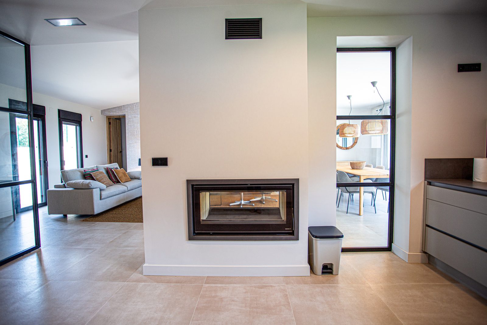 Modern interior with fireplace and open living area of a 3-bedroom villa in Denia - The Estates