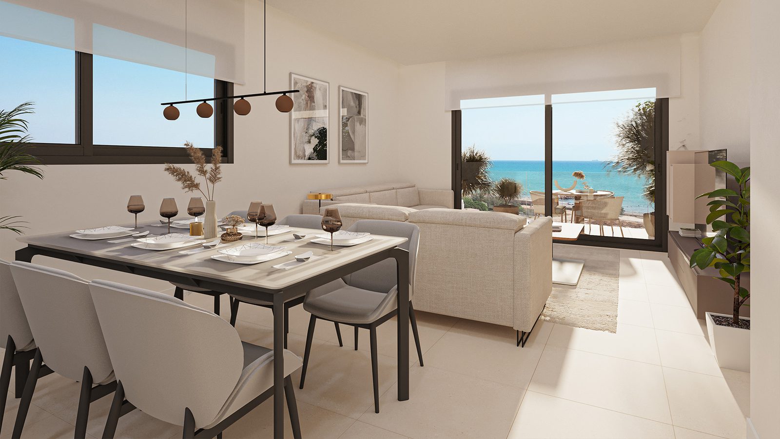 A bright living and dining area with a balcony overlooking the sea in a 3-bedroom apartment in El Puig - The Estates