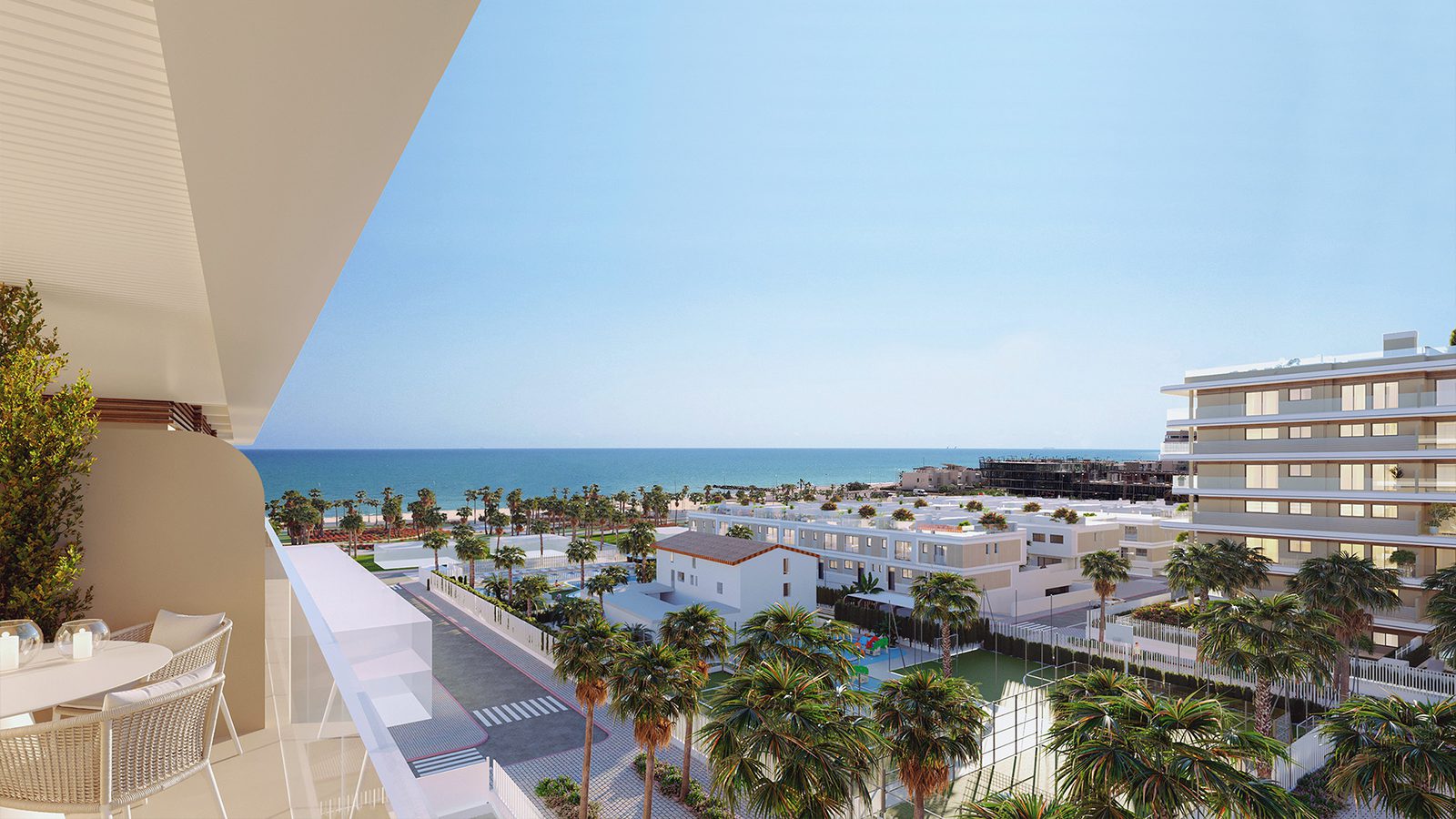 A balcony view of a 3-bedroom apartment in El Puig overlooking the beach and town - The Estates