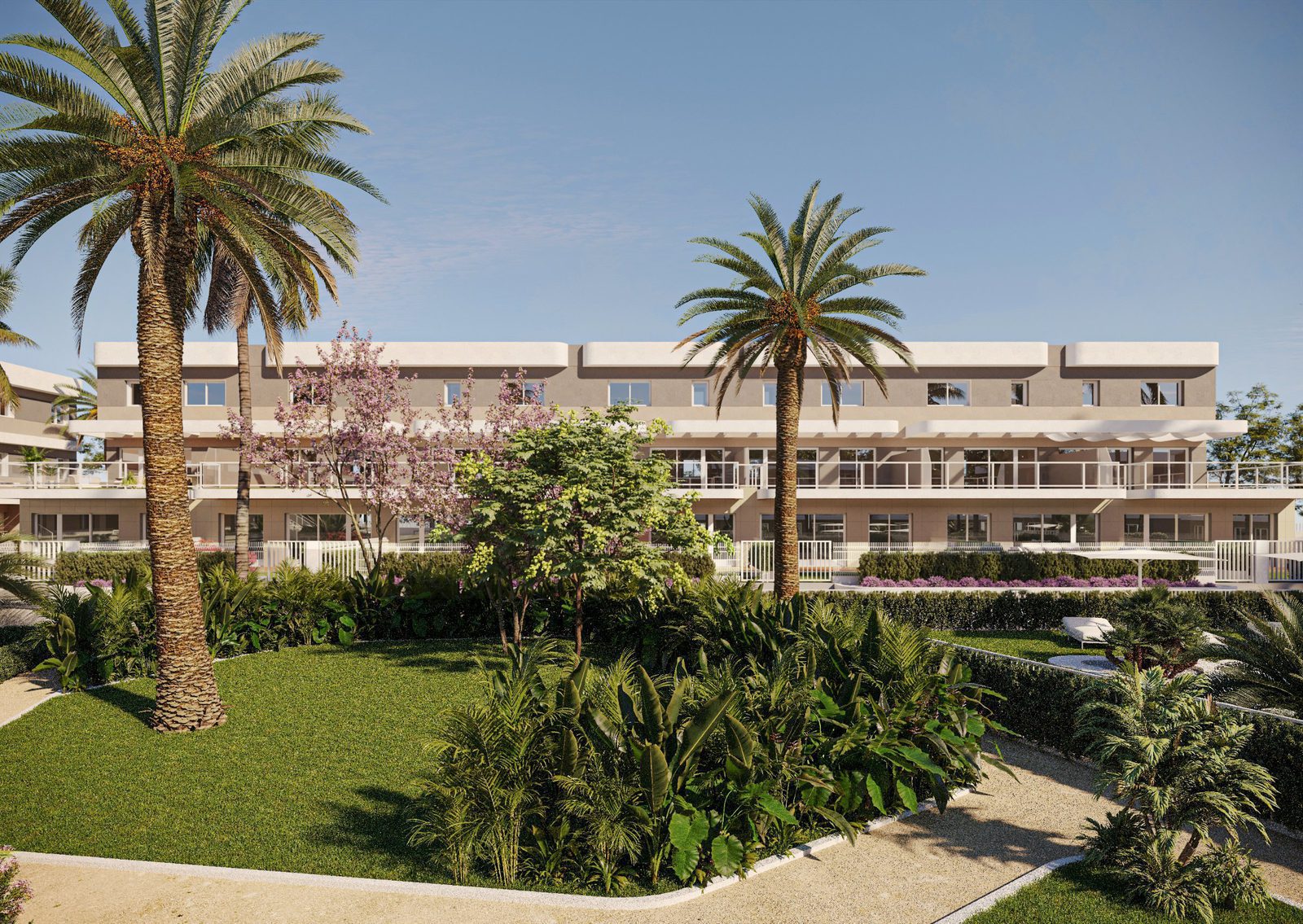 Exterior view of a modern 2-bedroom apartment complex with palm trees and lush landscaping - The Estates