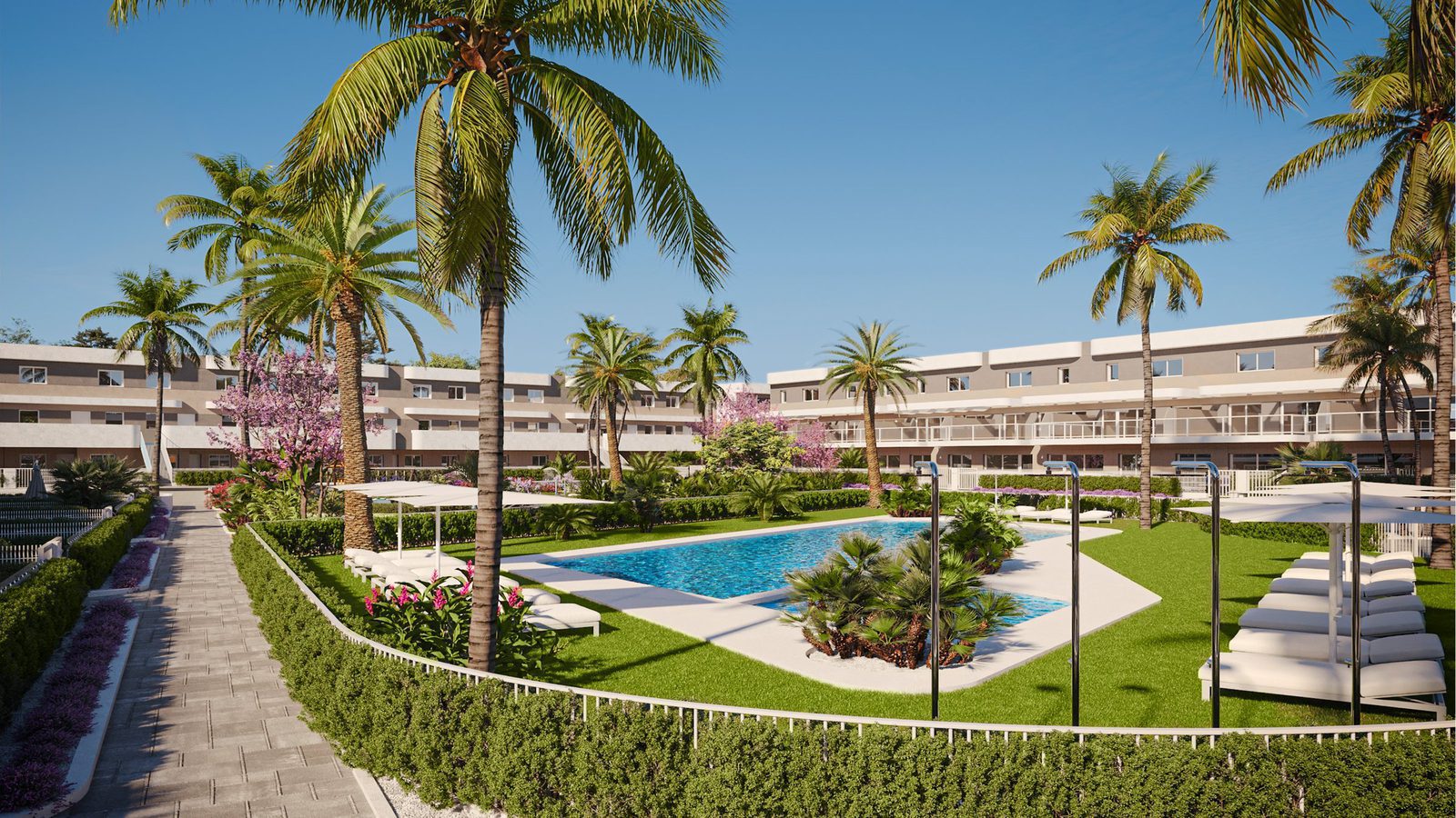 A view of the communal pool and gardens of a 2-bedroom apartment in Alicante - The Estates