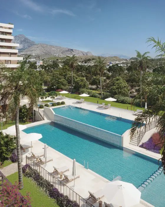 A stunning pool area with sea and garden views from a 3-bedroom penthouse in Villajoyosa - The Estates