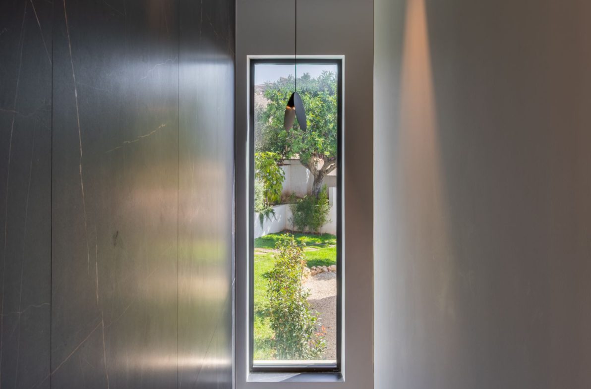 A view through a window of a 5-bedroom villa in Benitachell - The Estates