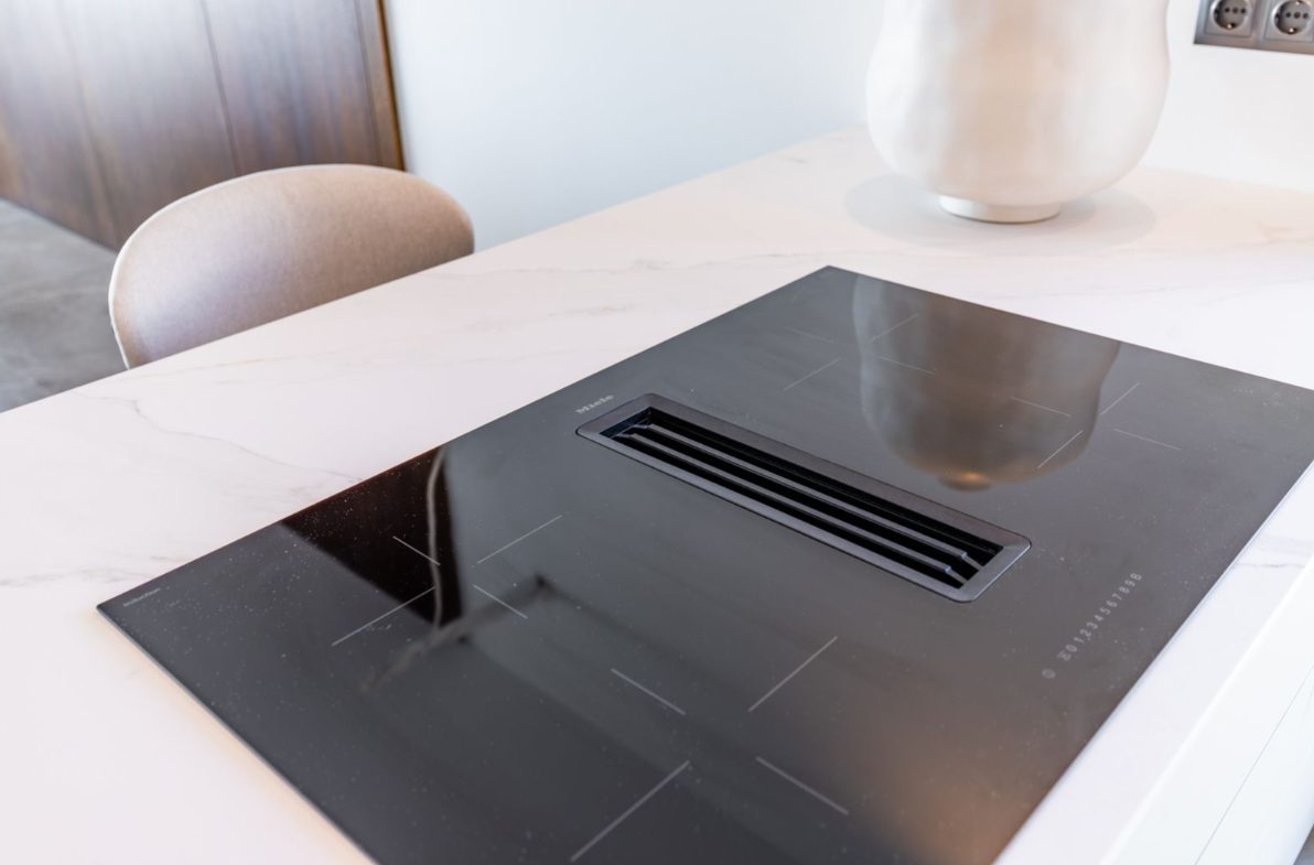 Modern kitchen with sleek induction hob in a 5-bedroom villa in Benitachell - The Estates