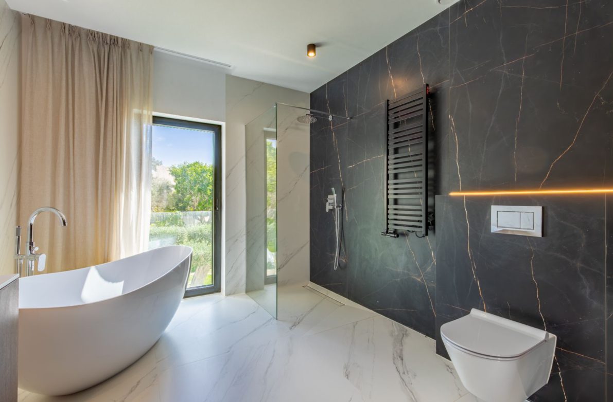 Luxurious bathroom with a freestanding tub and walk-in shower in a 5-bedroom villa in Benitachell - The Estates