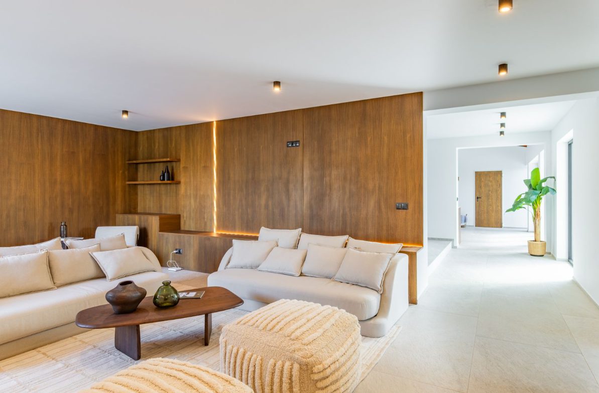 Stylish living room with wood paneling and comfortable seating in a 5-bedroom villa in Benitachell - The Estates
