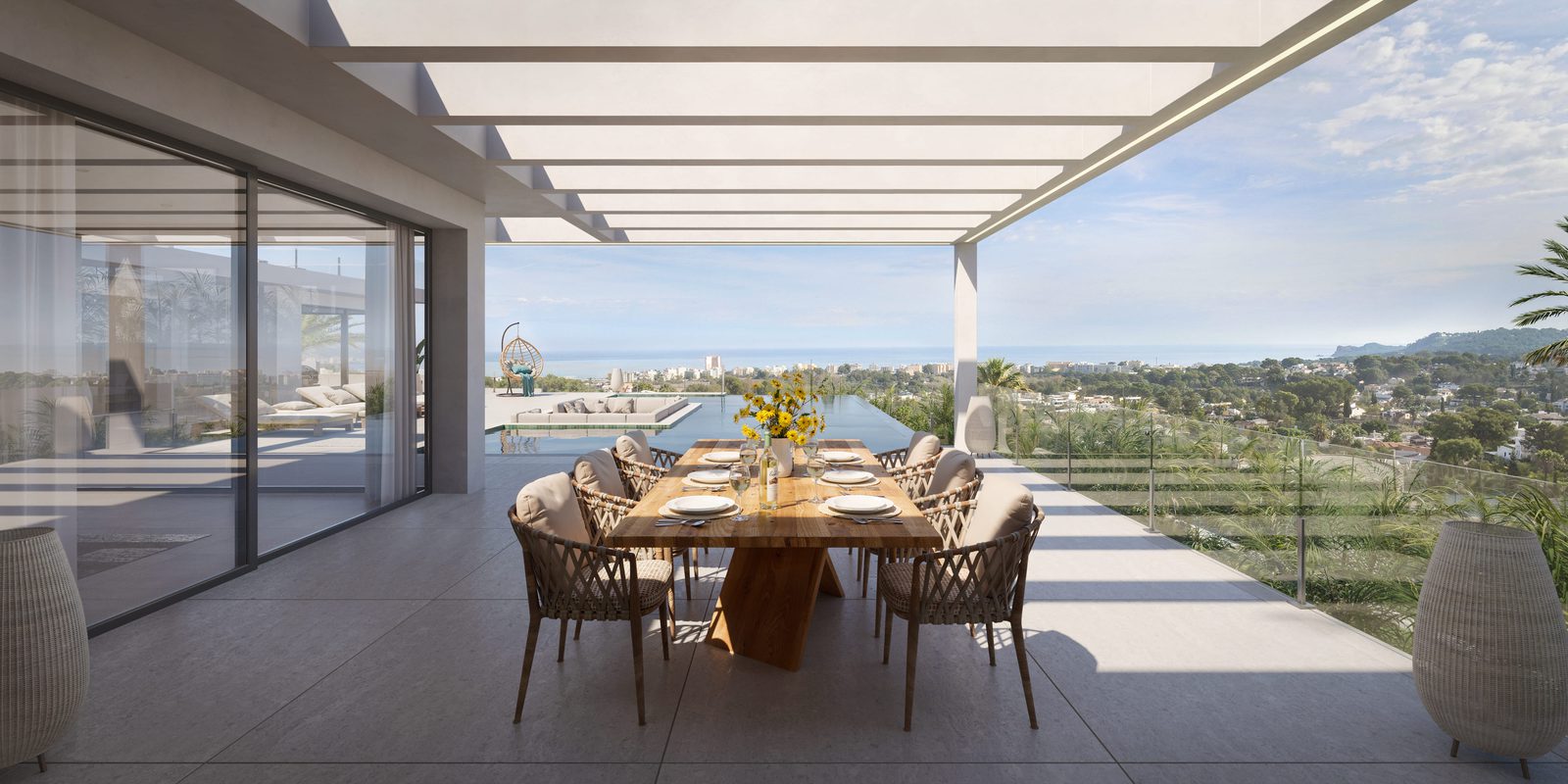 Outdoor dining area with stunning sea and city views of a 5-bedroom villa in Javea - The Estates