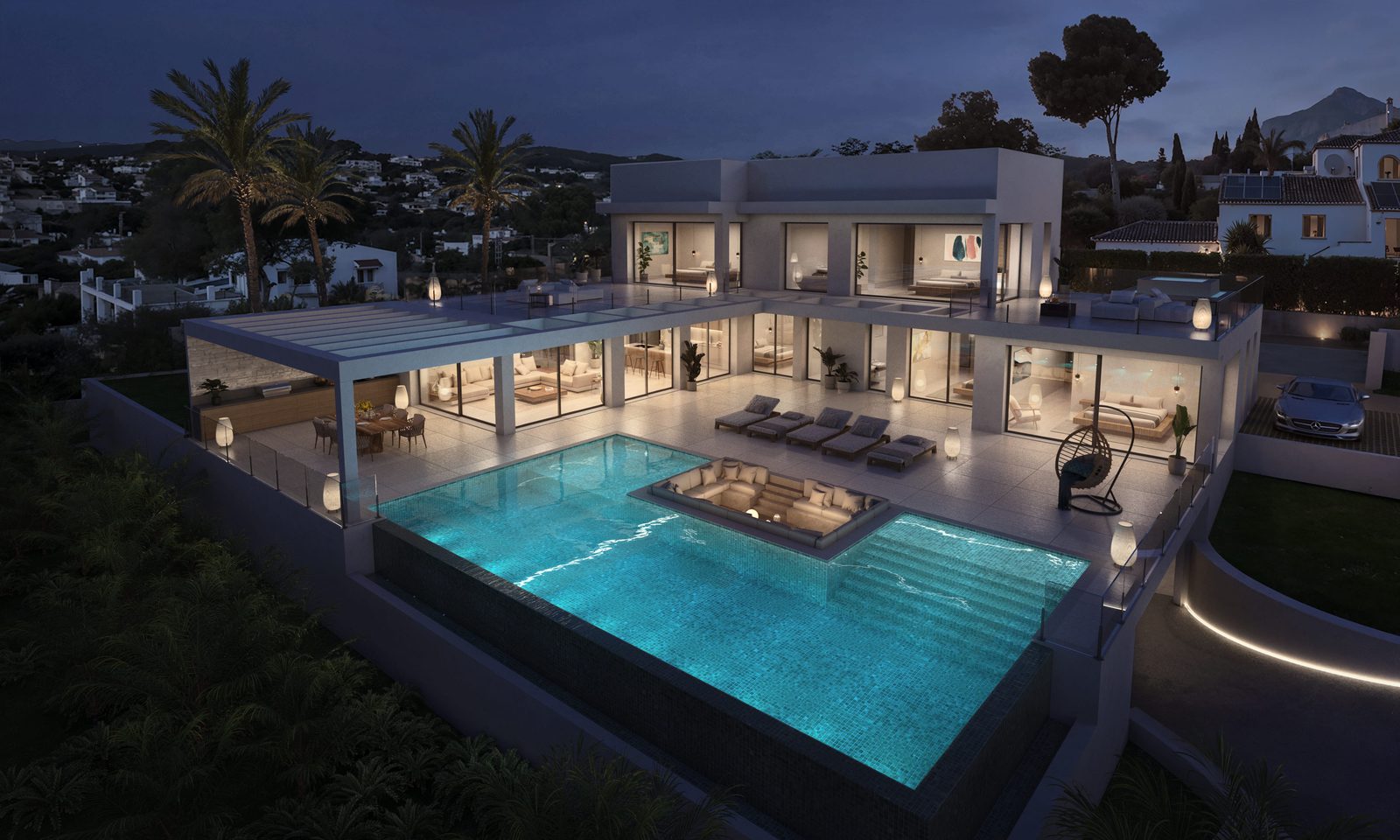 An elevated view of a luxurious villa with a pool and stunning sea and city views in Javea - The Estates