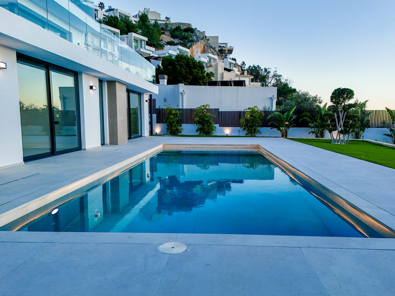 Modern villa pool terrace with landscaped garden and hillside homes in Altea - The Estates