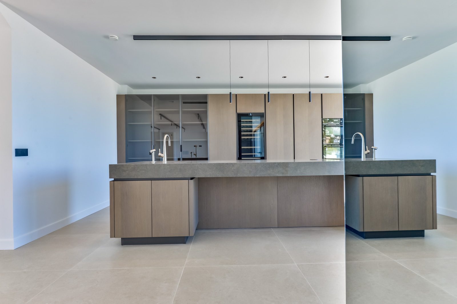 Modern kitchen with a large island of a 4-bedroom villa in Altea - The Estates