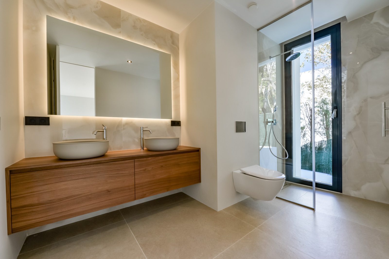 Modern bathroom with double vanity and walk-in shower in a 4-bedroom villa in Altea - The Estates