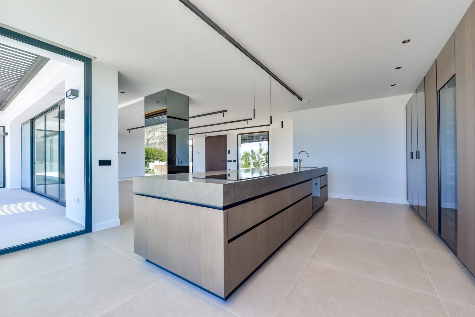 Modern kitchen with a large island of a 4-bedroom villa in Altea - The Estates