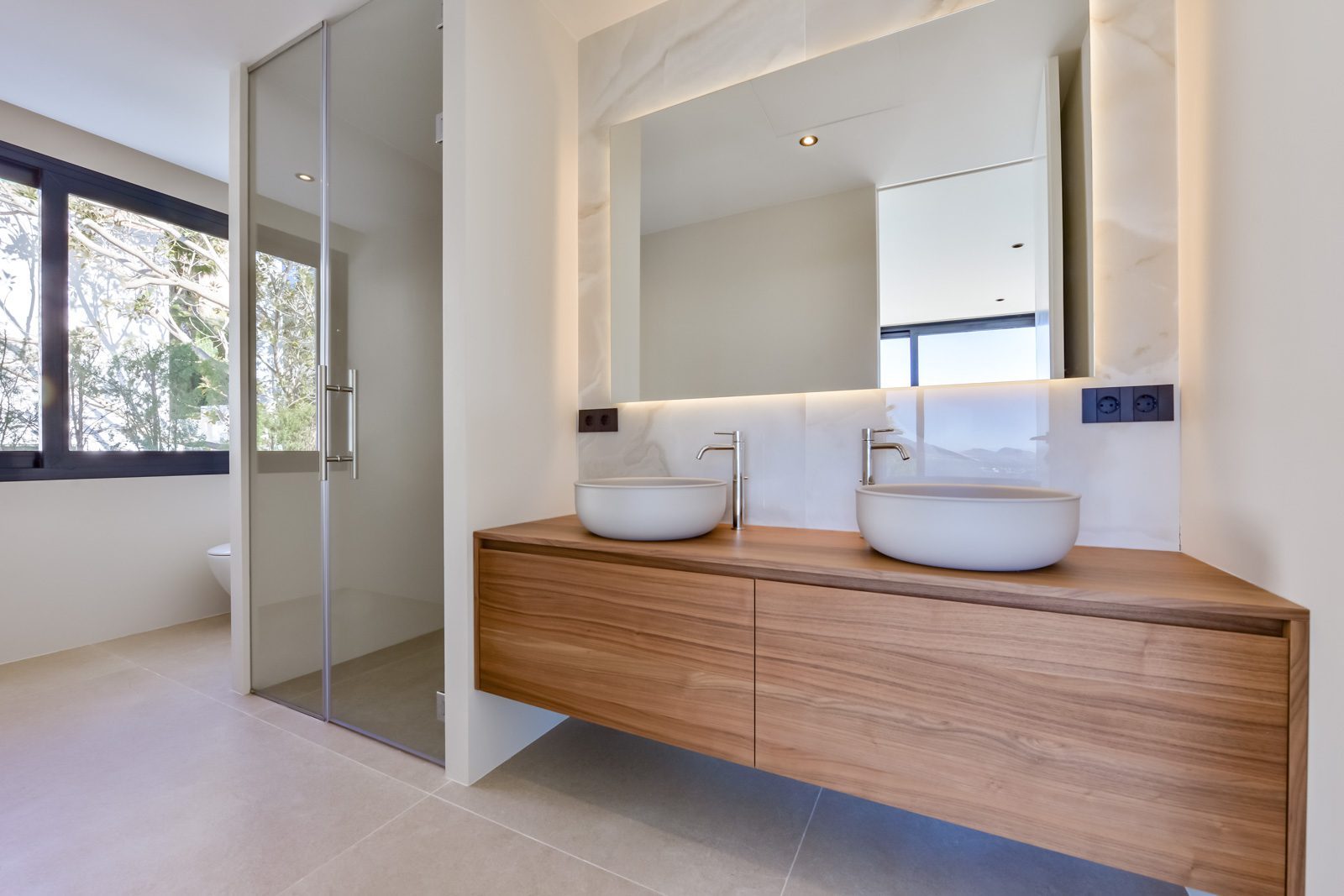 Contemporary bathroom with double vessel sinks and wood vanity in a 4-bedroom villa in Altea - The Estates