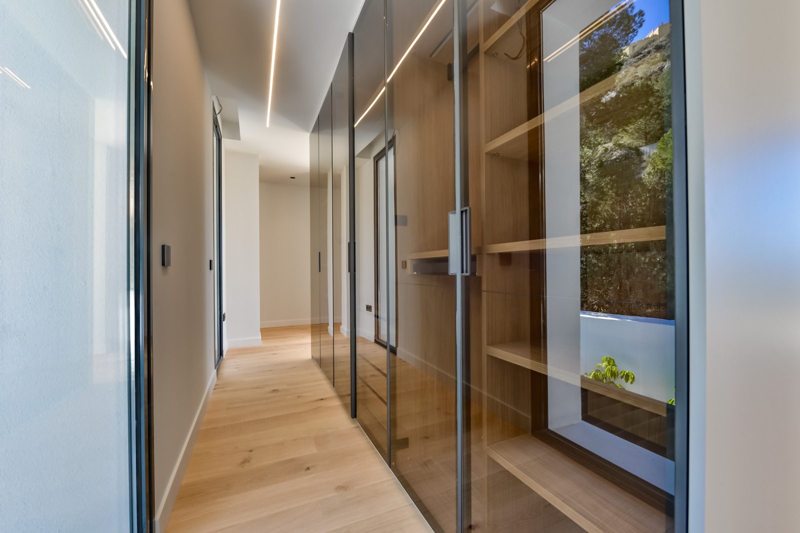 Modern hallway with mirrored wardrobes and