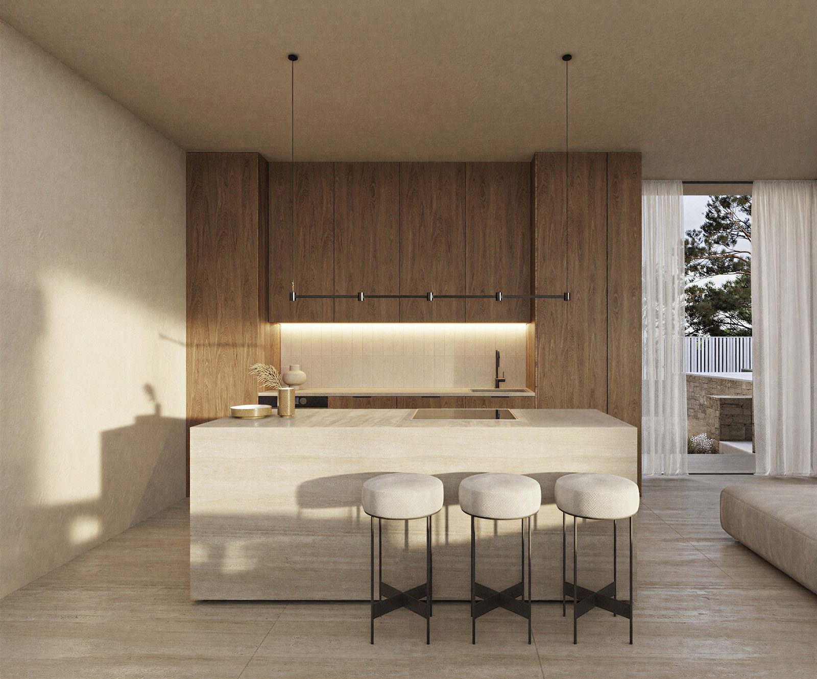 Modern kitchen with wood cabinetry, stone island and three stools in a 4-bedroom villa in Benissa - The Estates