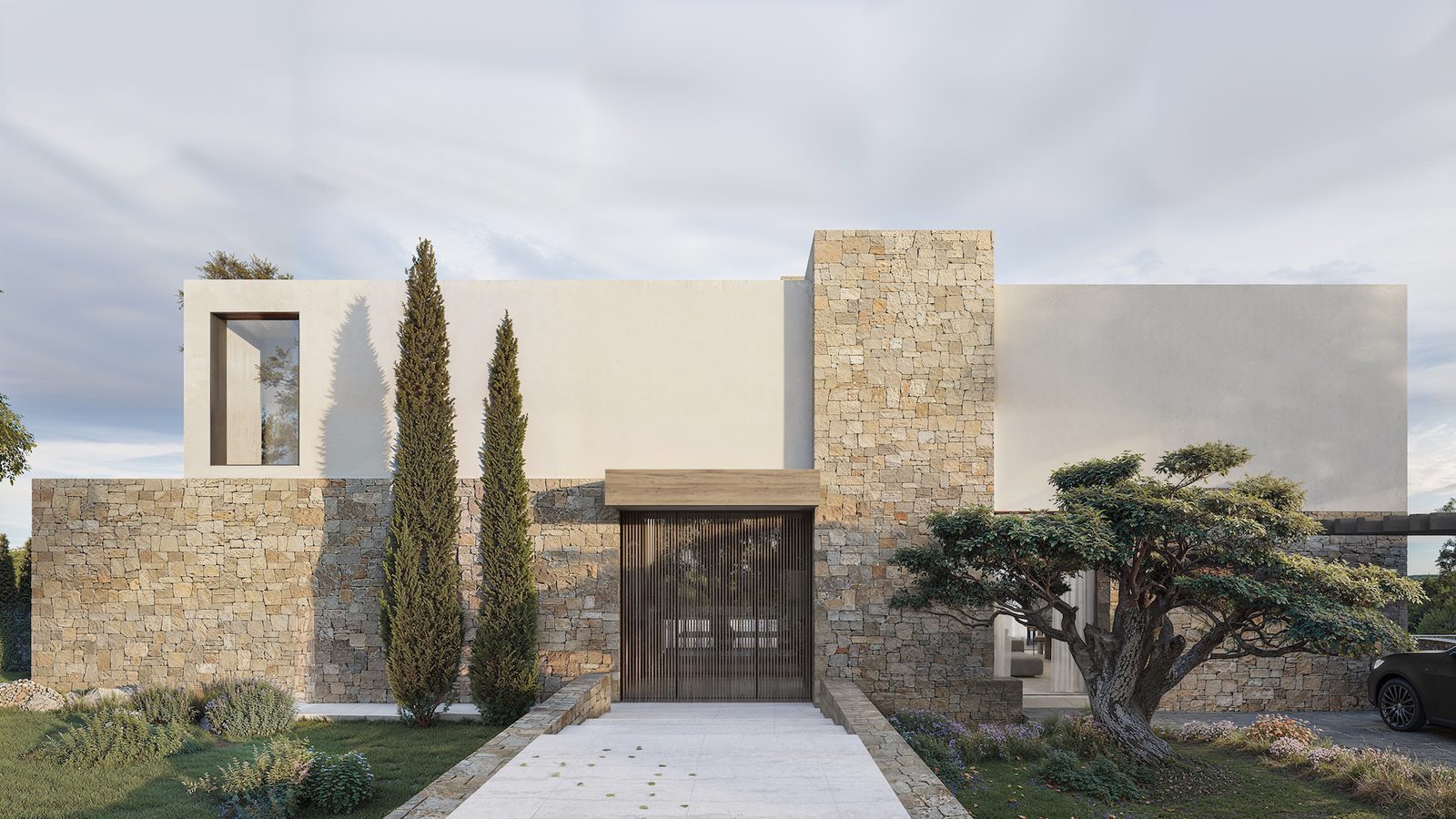 Modern stone-clad entrance facade and landscaped garden of a 4-bedroom villa in Benissa - The Estates