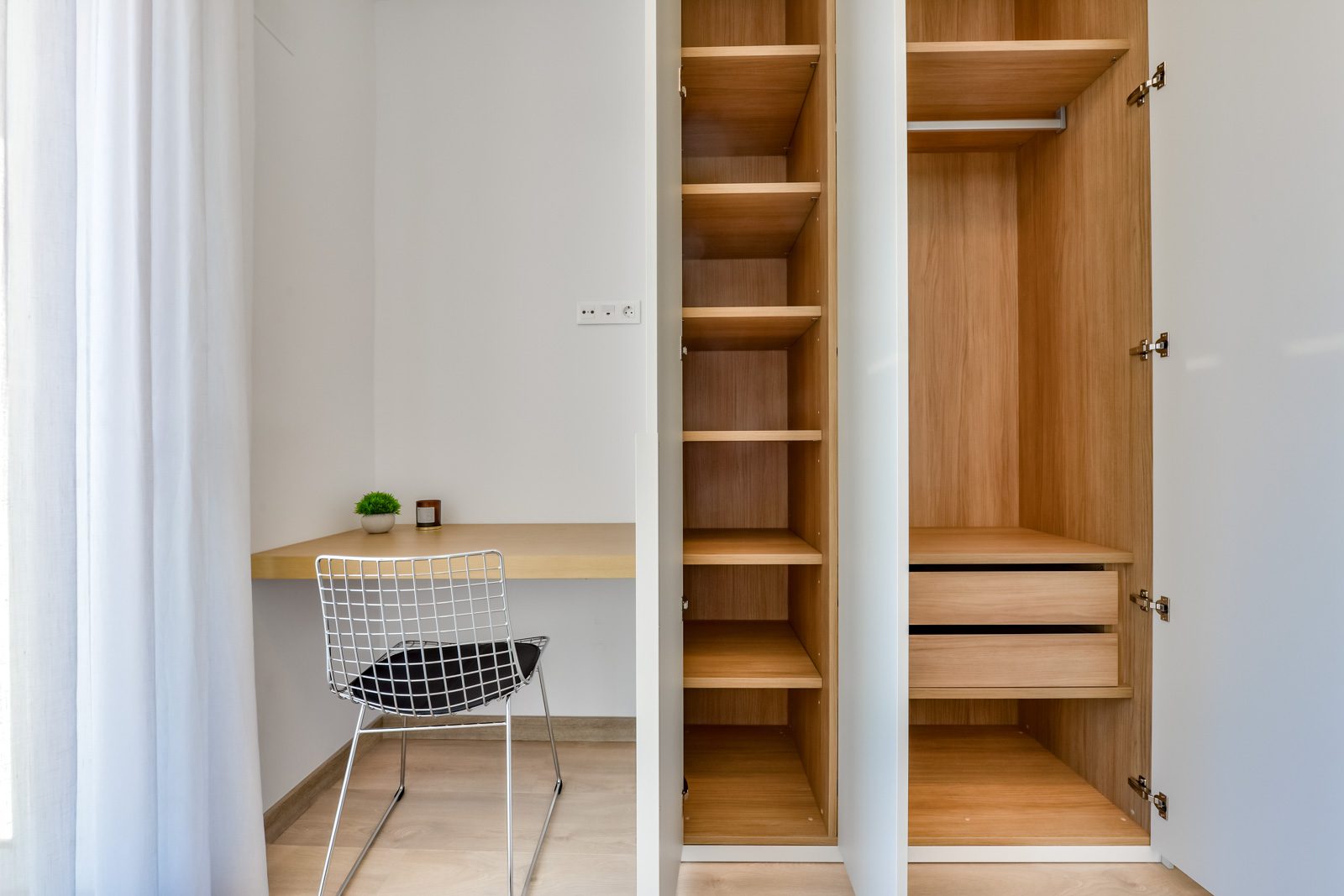 A built-in wardrobe and desk area in a 3-bedroom villa in Altea - The Estates