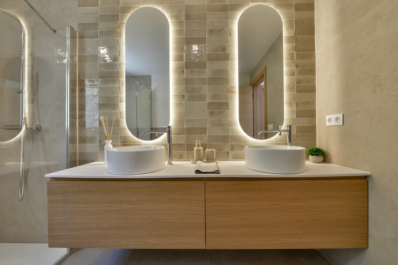 A modern bathroom with double sinks and stylish lighting in a 3-bedroom villa in Altea - The Estates