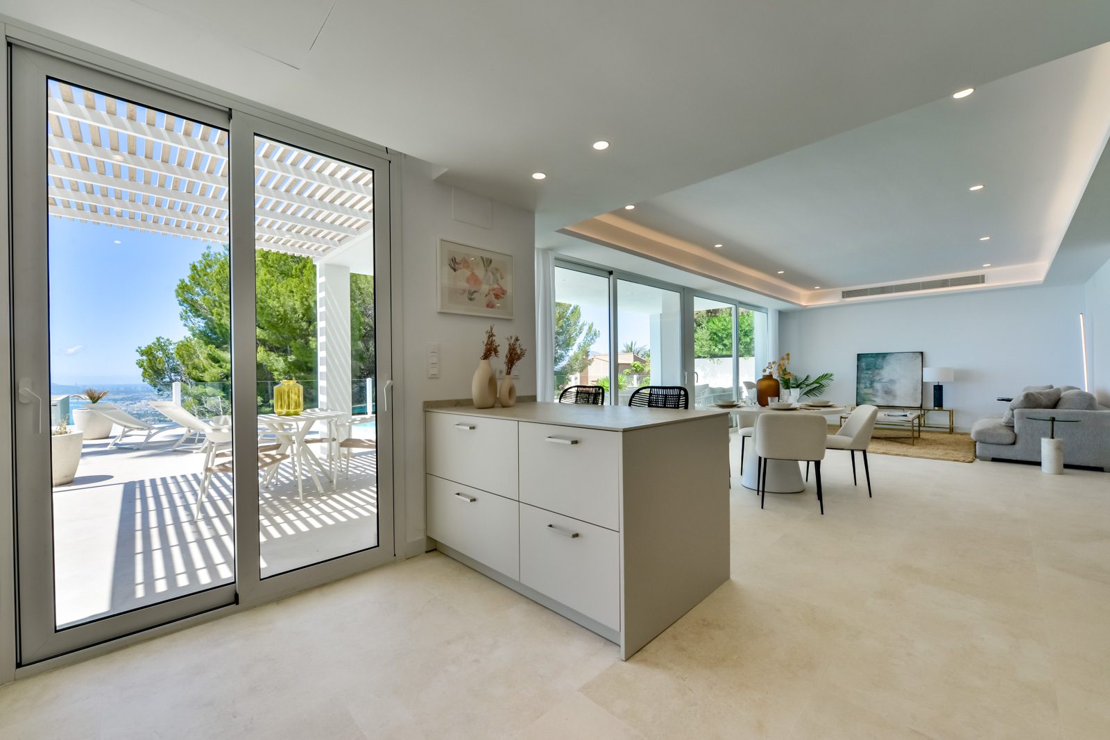 Modern kitchen and living area with sea views in a 3-bedroom villa in Altea - The Estates
