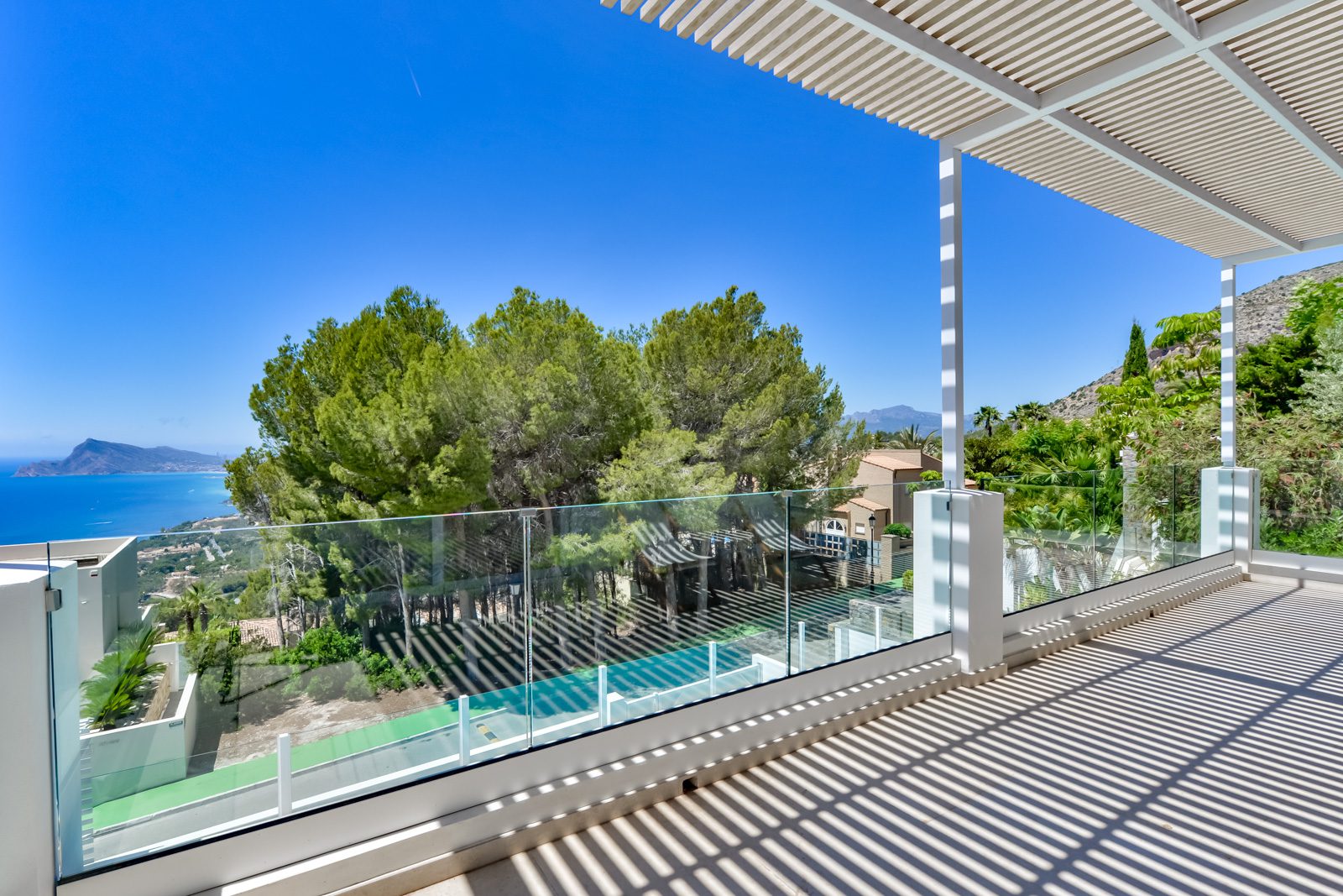 A covered terrace with sea views from a 3-bedroom villa in Altea - The Estates