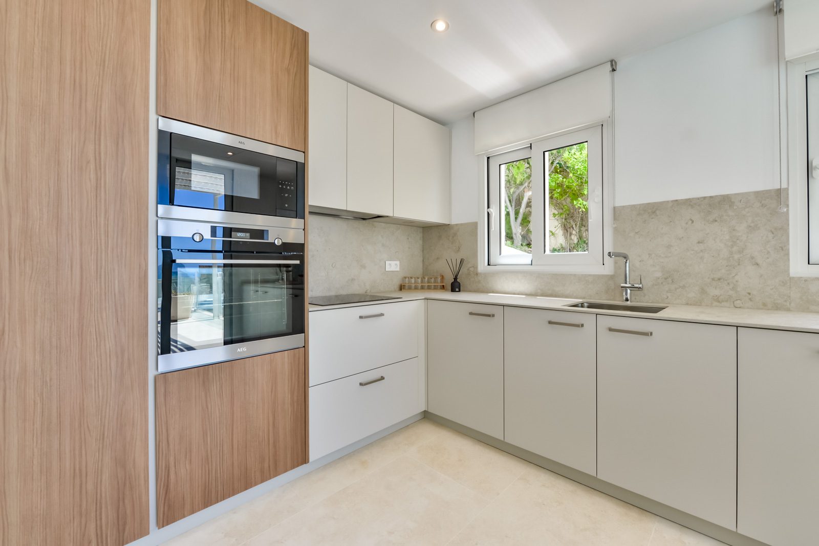 Modern kitchen with stainless steel appliances in a 3-bedroom villa in Altea - The Estates
