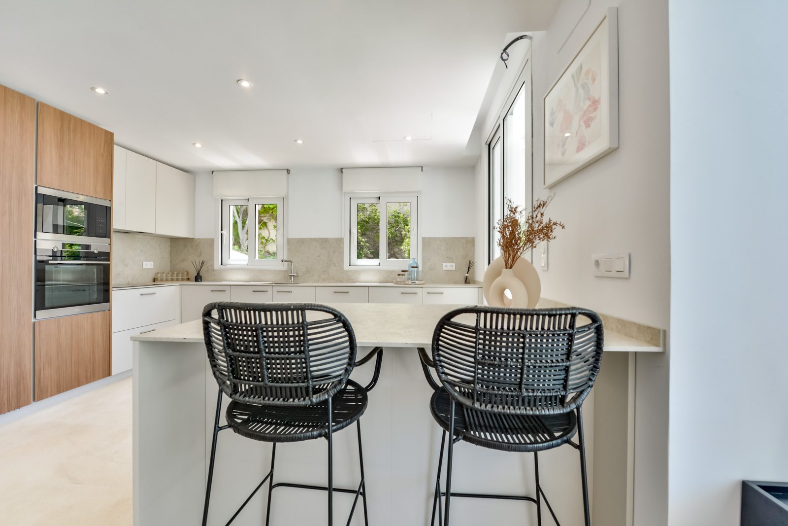 Modern kitchen with island seating in a 3-bedroom villa in Altea - The Estates