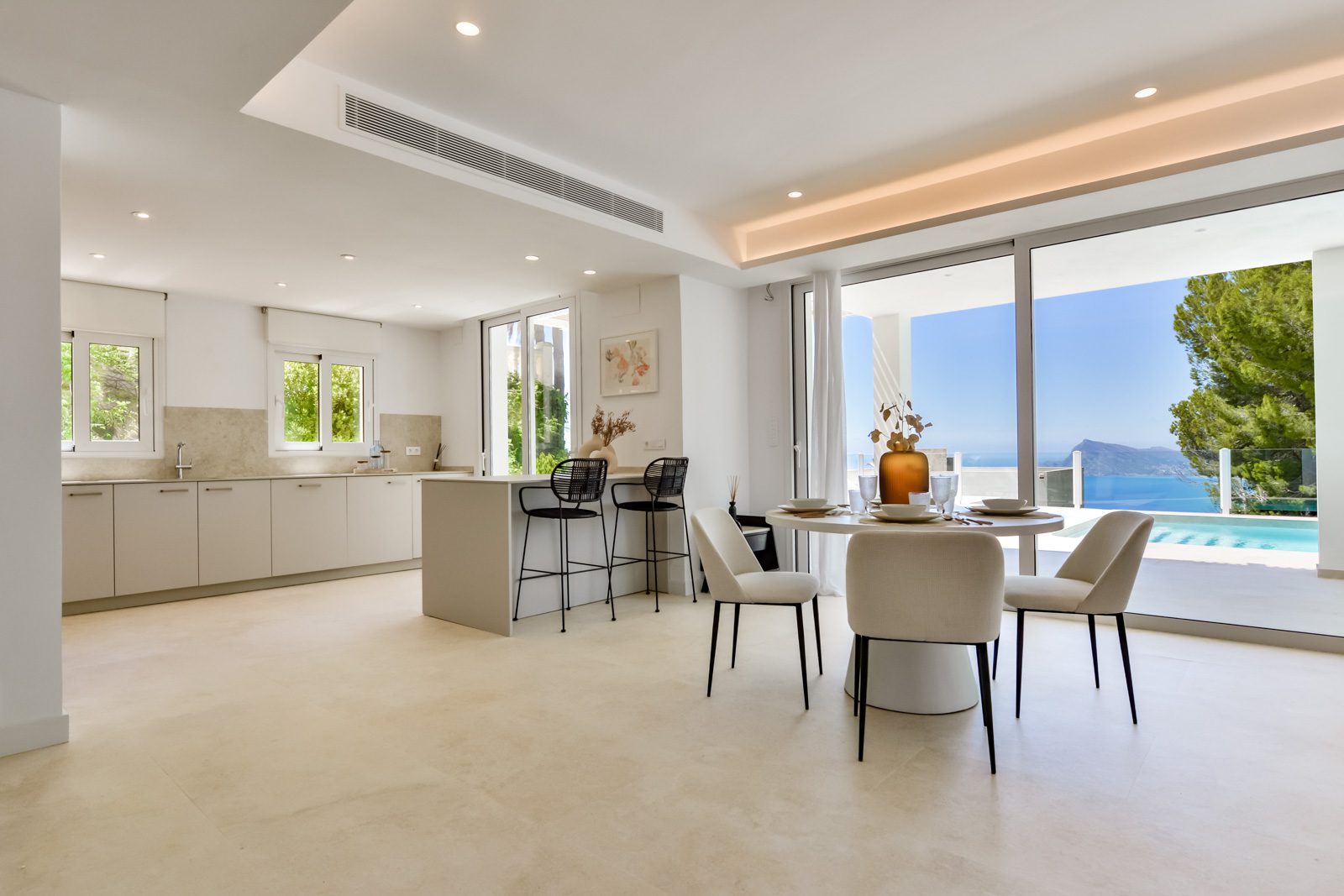 Bright, modern living area with sea views inside a 3-bedroom villa in Altea - The Estates