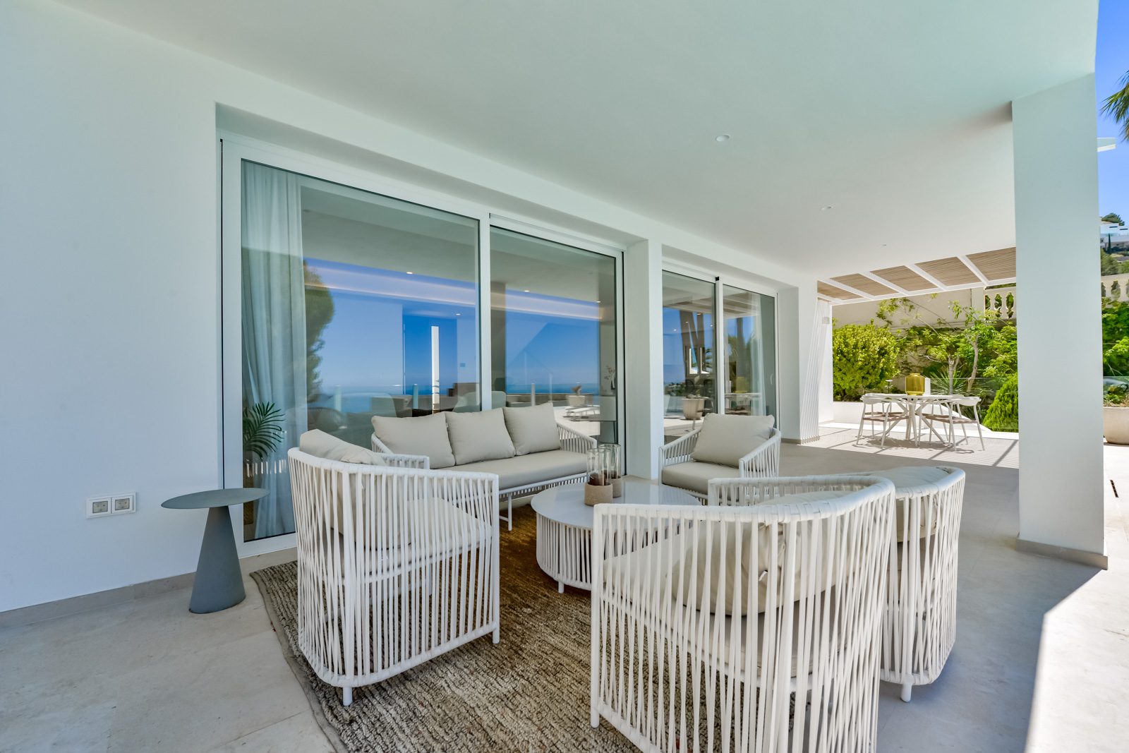 Outdoor lounge area with stunning sea views of a 3-bedroom villa in Altea - The Estates