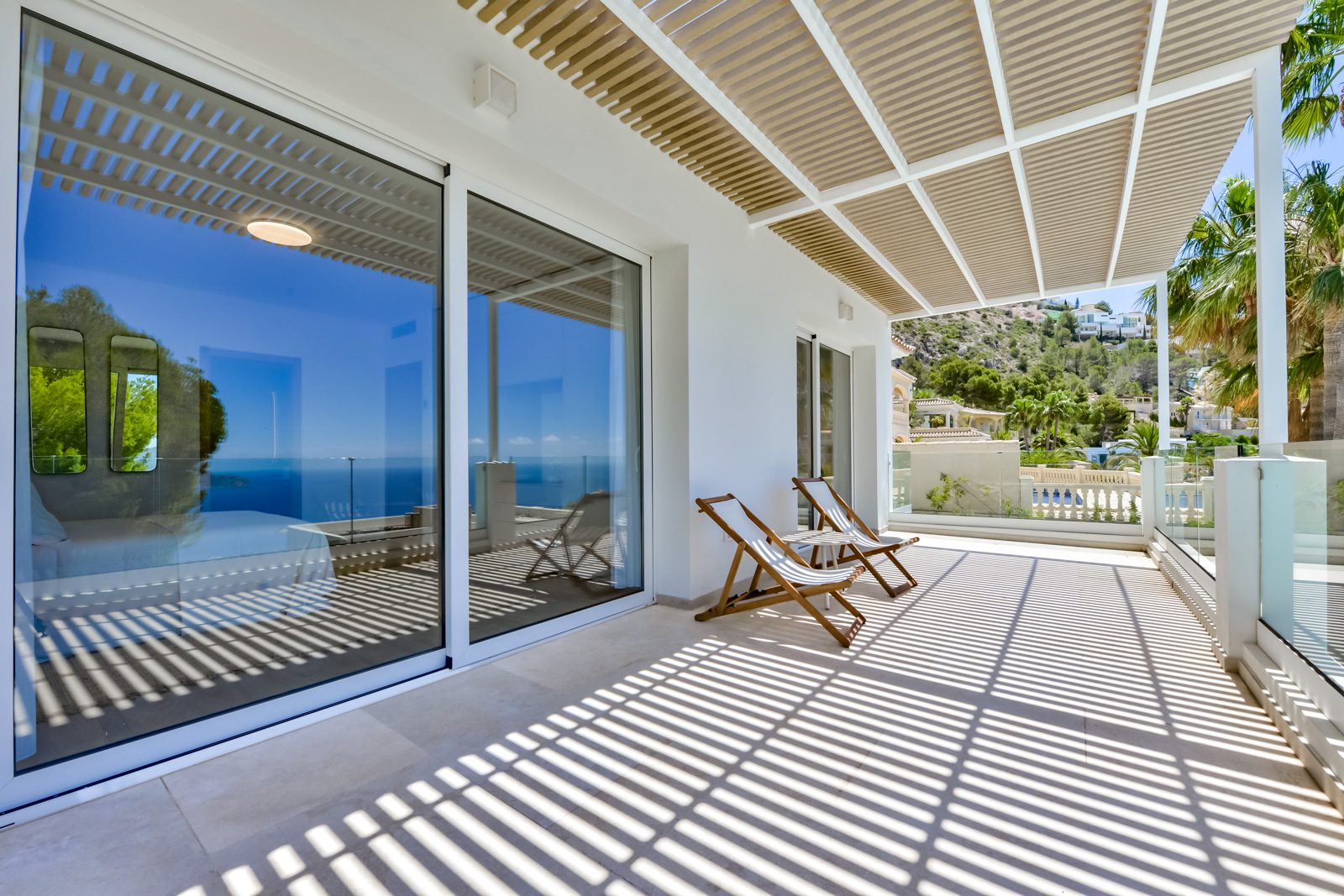 A covered terrace with sea views at a 3-bedroom villa in Altea - The Estates